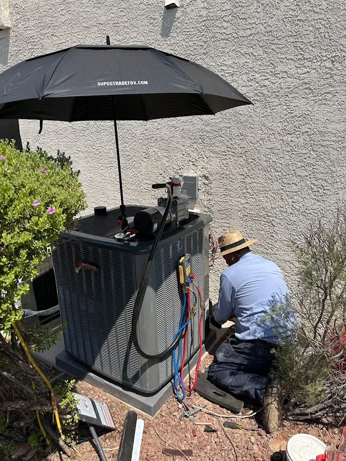 HVAC technician performing outdoor AC maintenance in Shawangunk